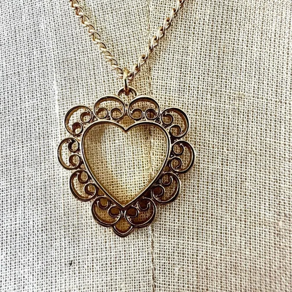 Gold tone open heart pendant necklace